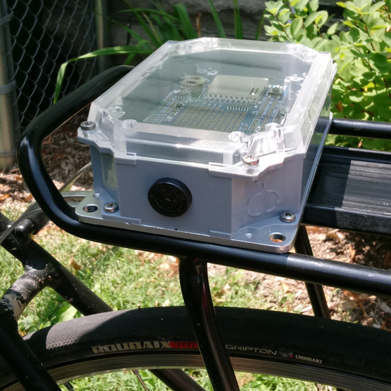 A distance sensing device mounted to a bicycle rack