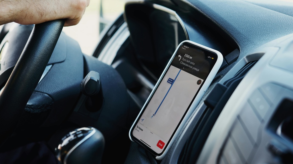 A smartphone being used for navigation in a car