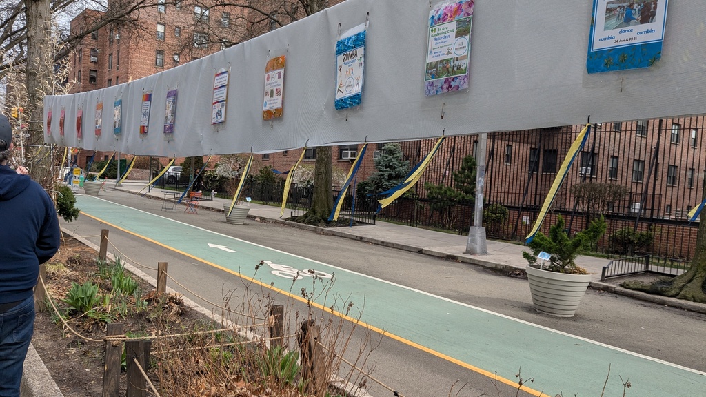 Posters along 34th Avenue in NYC
