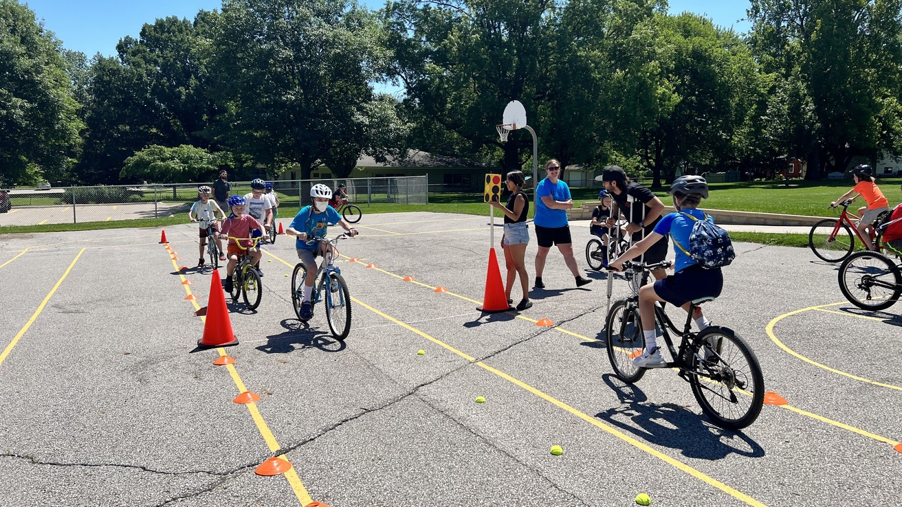 Kids practicing bike skills at an elementary school